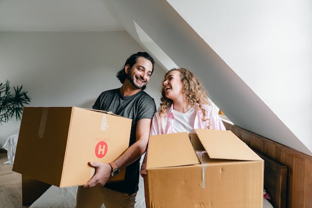 two%20tenants%20smiling%20while%20holding%20moving%20boxes two%20tenants%20smiling%20while%20holding%20moving%20boxes